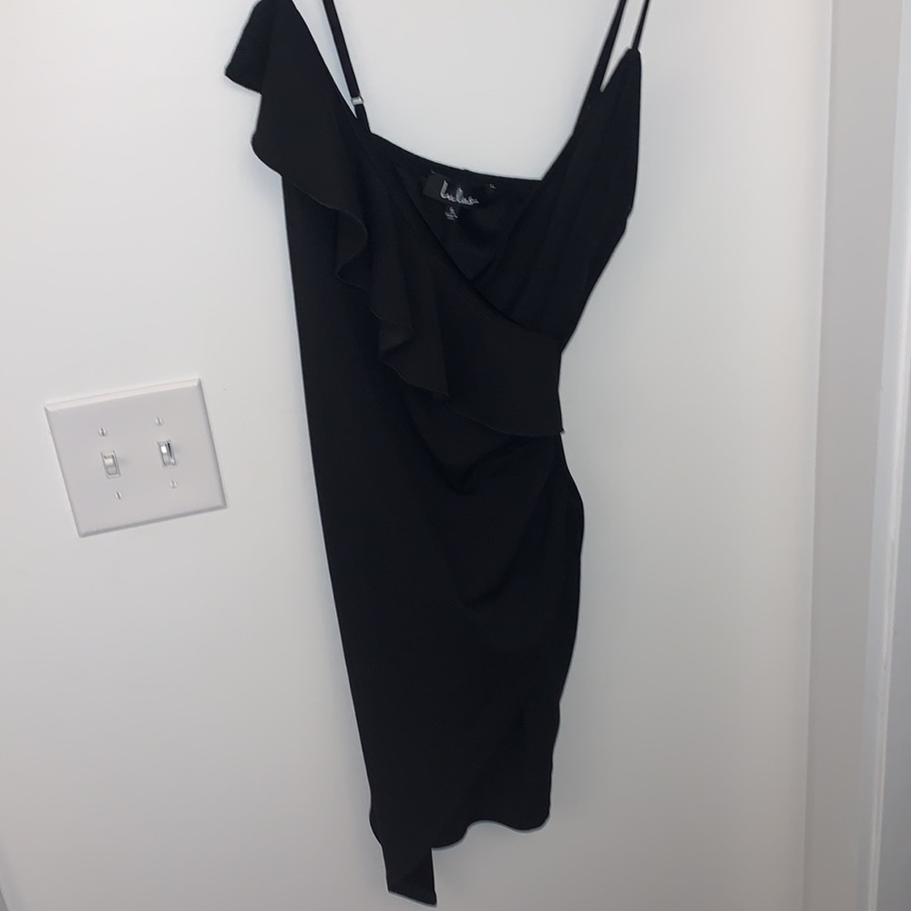 Asymmetrical little black dress with ruffle